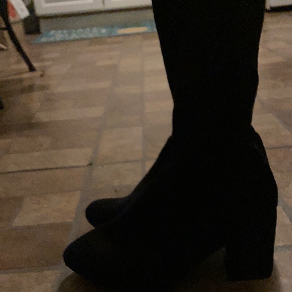 Heeled boots over the knees